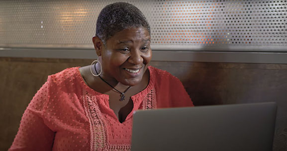 Woman looking at laptop